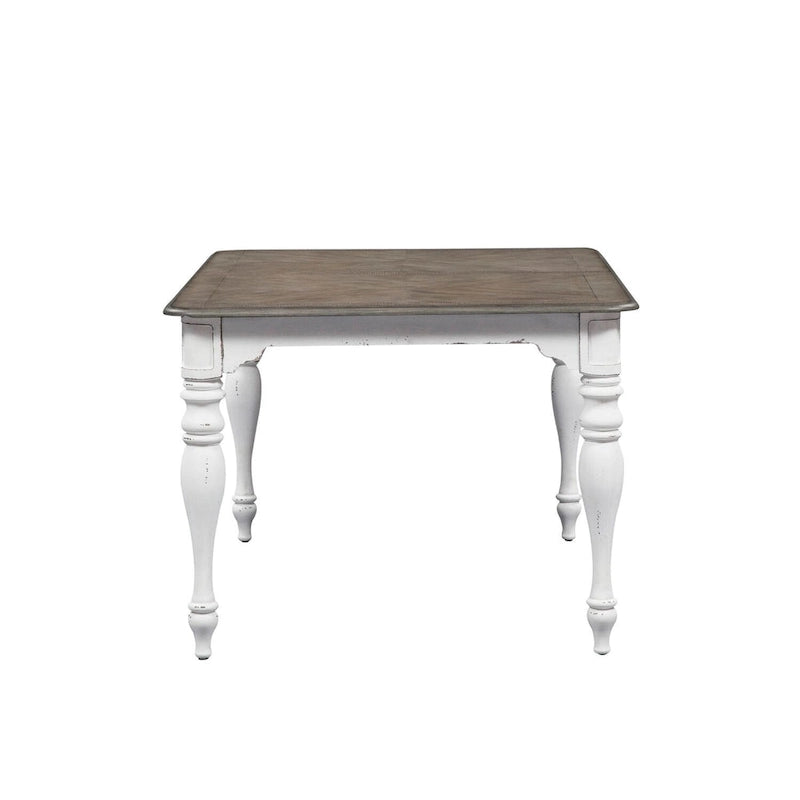 Table Magnolia Manor Antique White à pieds en écorce patinée